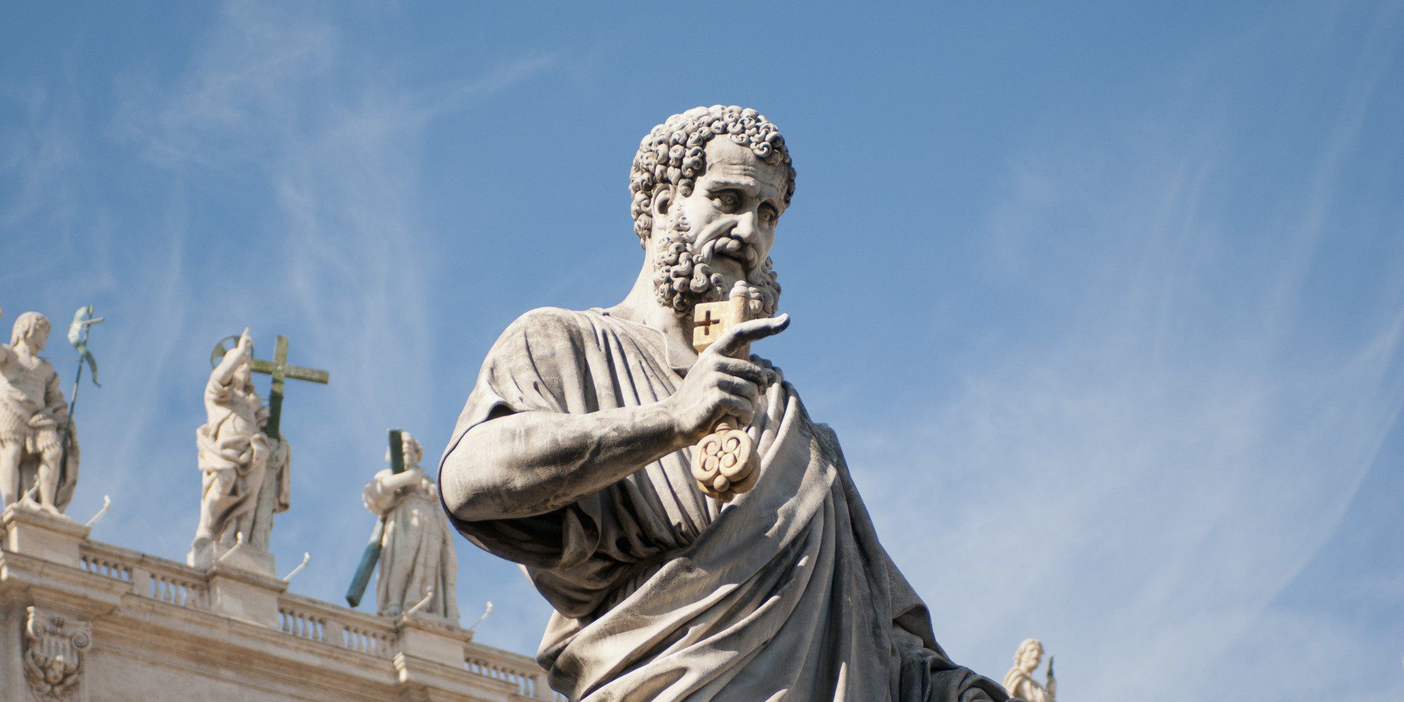 Statue of St. Peter and the Bascilica's facade