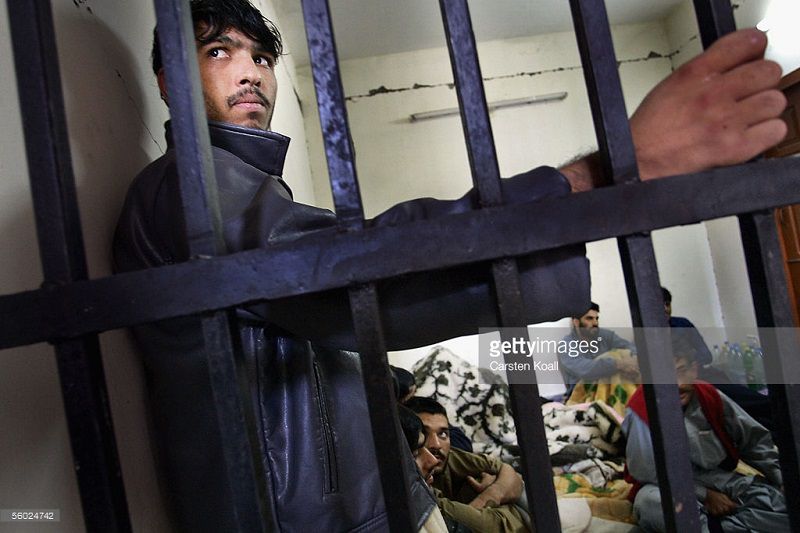 MUZAFFARABAD, PAKISTAN - OCTOBER 27: Inmates are held in the police prison on October 27, 2005 in Muzaffarabad, Pakistan controlled Kashmir. The prisons in this region were damaged in the earthquake, inmates have been given treatment from the German red cross. The current death toll is now believed to be over 54,000 from the South Asian earthquake that happened over 2 weeks ago. Over 3 million people are without proper shelter and aid organizations including the U.N are warning that thousands could die in remote mountainous regions as Winter approaches. Atleast 1,400 died in Indian-Kashmir. (Photo by Carsten Koall/Getty Images)
