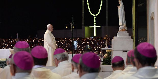 web-fatima-portigal-pope-francis-blessing-candles-c2a9afp-photo-osservatore-romano